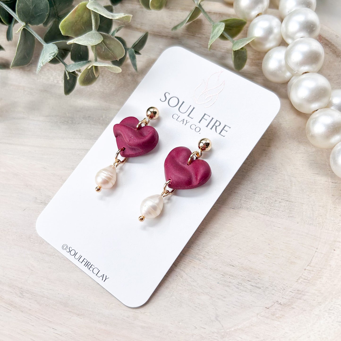 Draped Pearl Hearts Statement Earrings